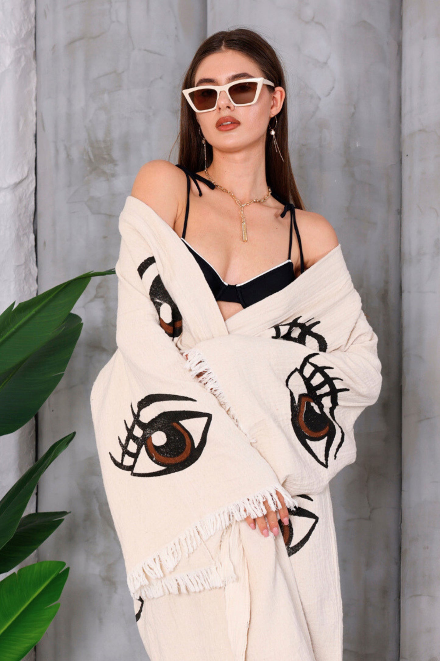 Model wearing Cocoa Dreams Kimono by Meraki Beach – organic cotton cream kimono with brown lucky eye design, sustainable resort wear