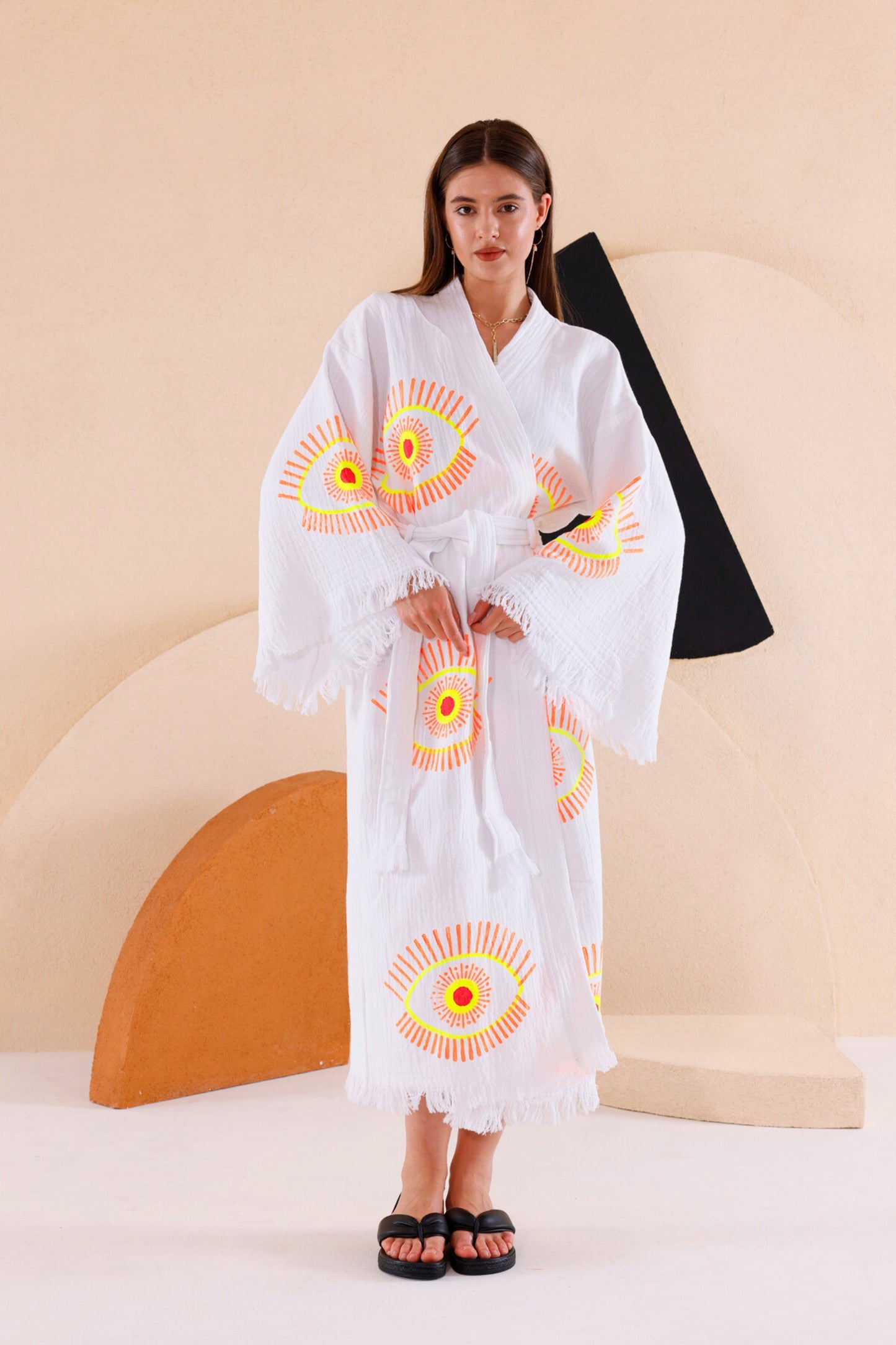 LADY WEARING THE NAYA ORGANIC COTTON KIMONO IN NEON