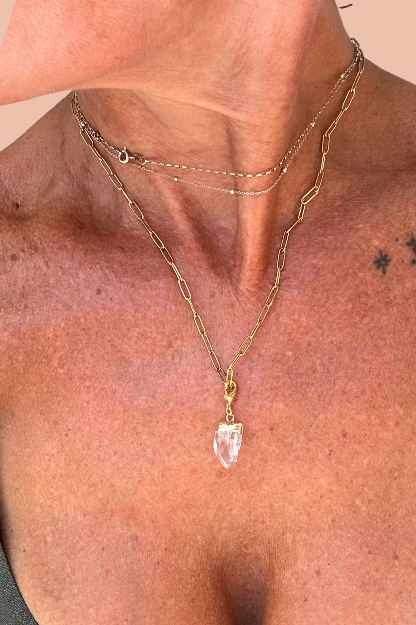 Clear Quartz crystal charm on gold-plated stainless steel chain necklace by Meraki Rituals