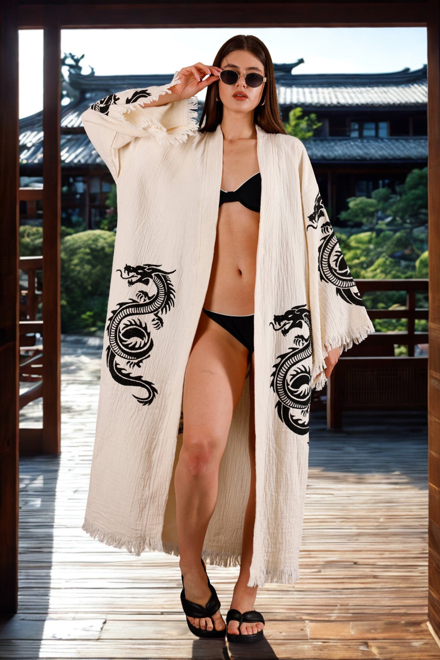 Meraki Beach HAKU Kimono in organic cotton cream, hand block printed with black Japanese dragon design – sustainable, ethical resort wear for women.