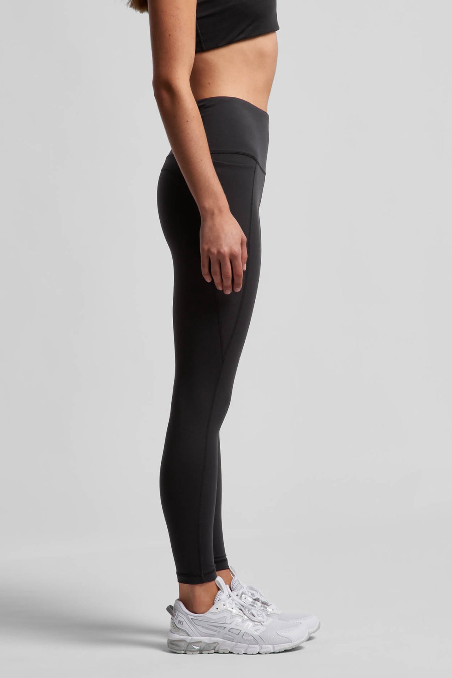 Model wearing MAREA Recycled Nylon Leggings in Black by Meraki Beach – sustainable high-waist activewear leggings made from ocean plastics
