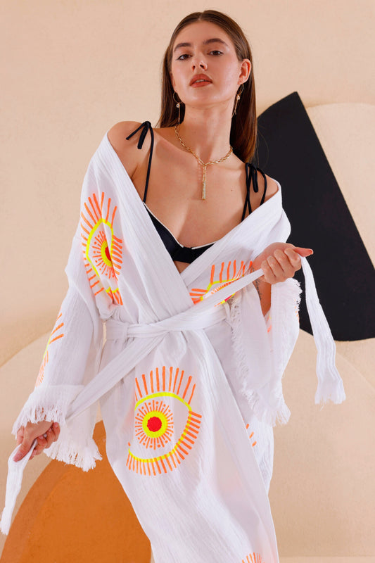 LADY WEARING THE NAYA ORGANIC COTTON KIMONO IN NEON