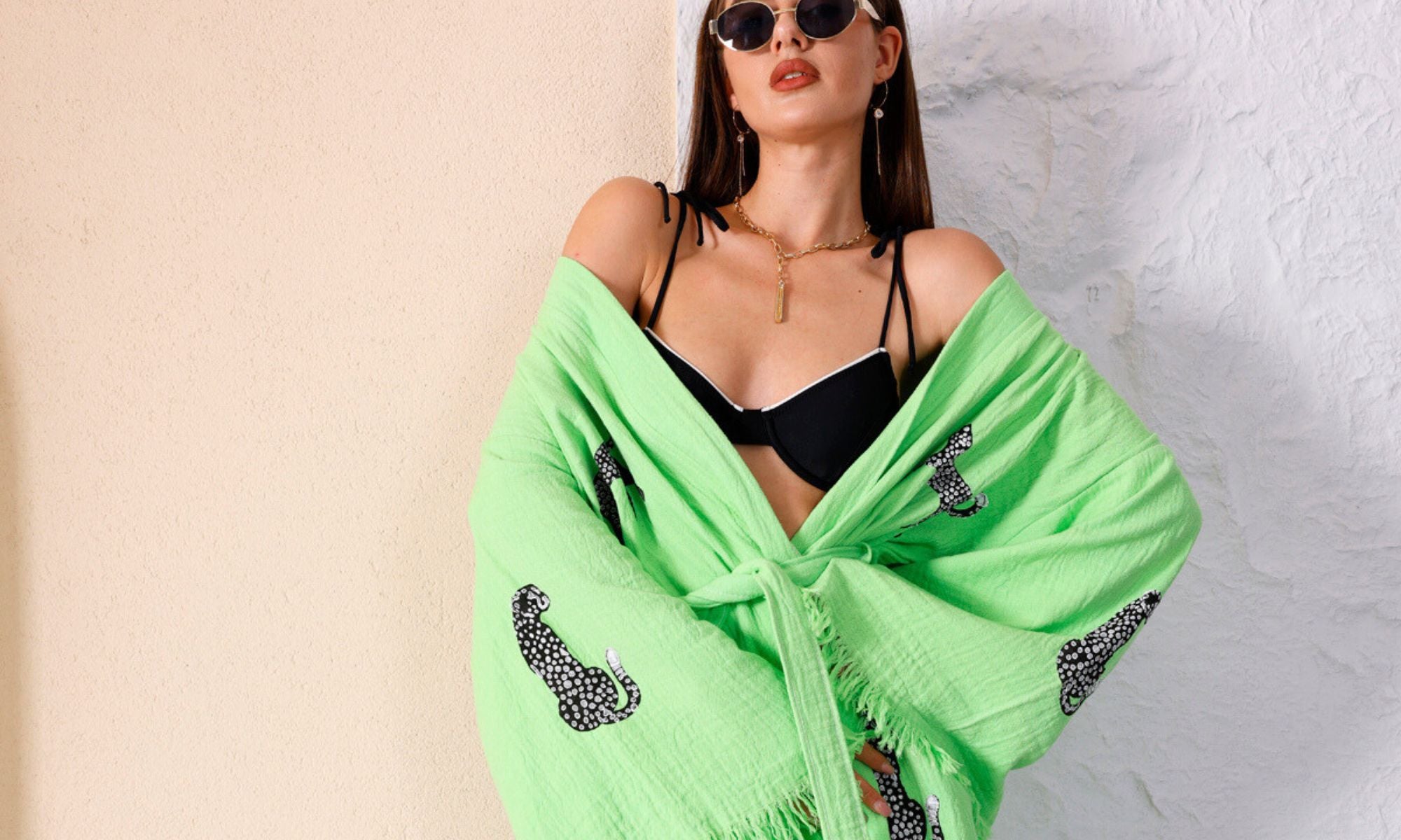 WOMAN WEARING OUR WILD LEOPARD ORGANIC COTTON KIMONO IN LIME GREEN - SUSTAINABLE RESORT WEAR