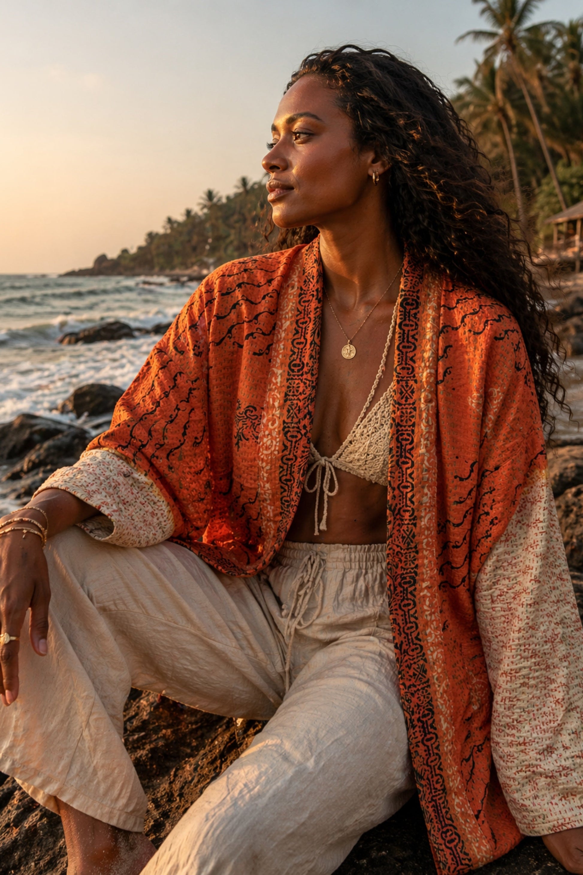 SILK KANTHA JACKET IN ORANGE, MADE FROM RECYCLED SARI FABRIC BY MERAKI BEACH. 