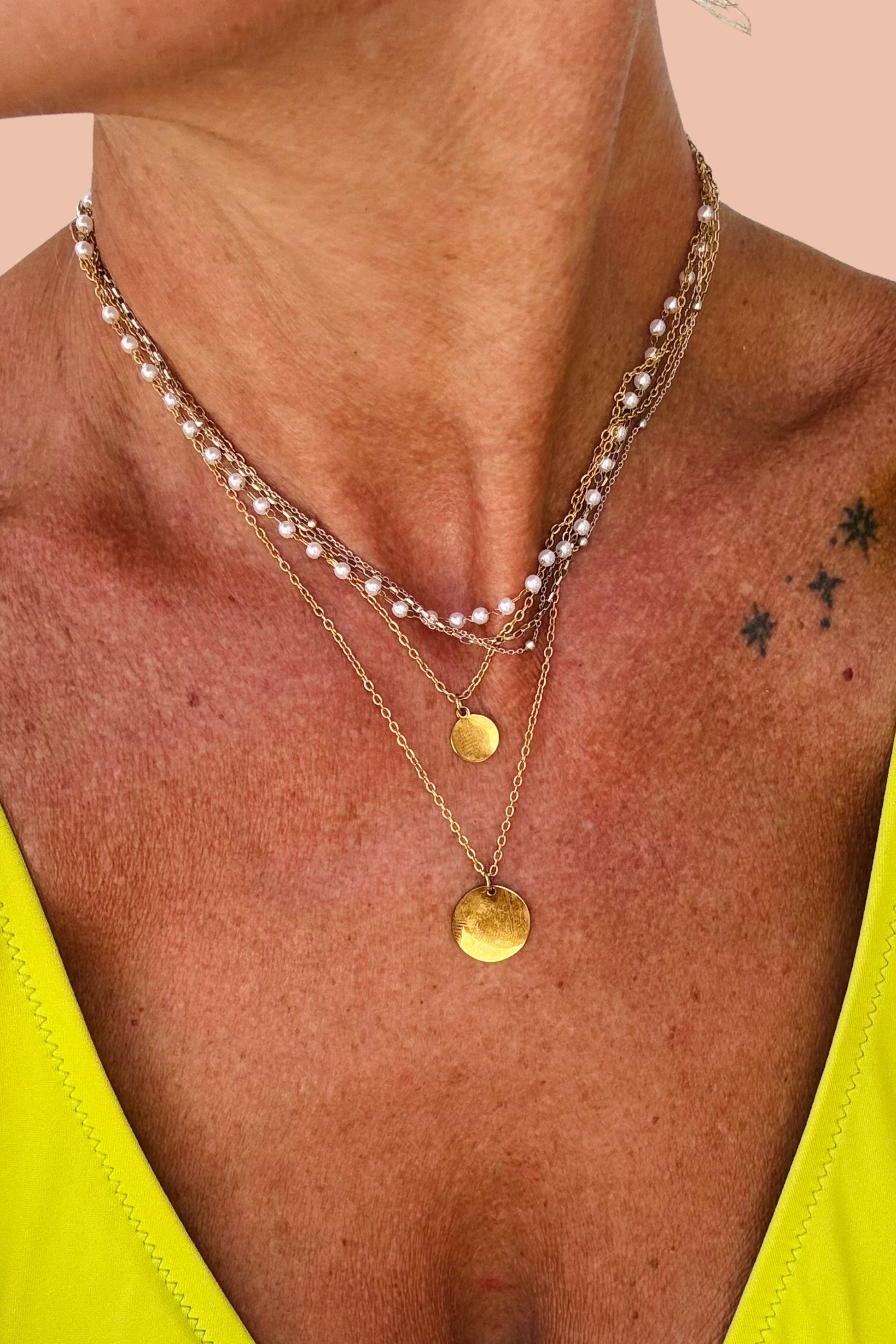 THALASSA PEARL AND GOLD COIN LAYERING NECKLACE BY MERAKI BEACH.