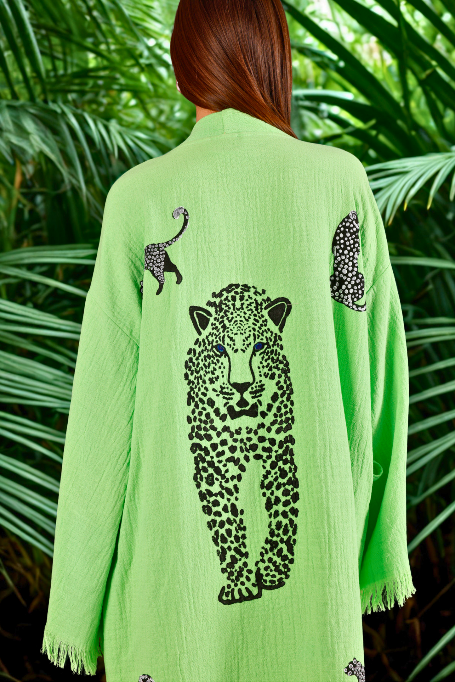 WOMAN WEARING ORGANIC COTTON WILD LEOPARD KIMONO IN LIME GREEN