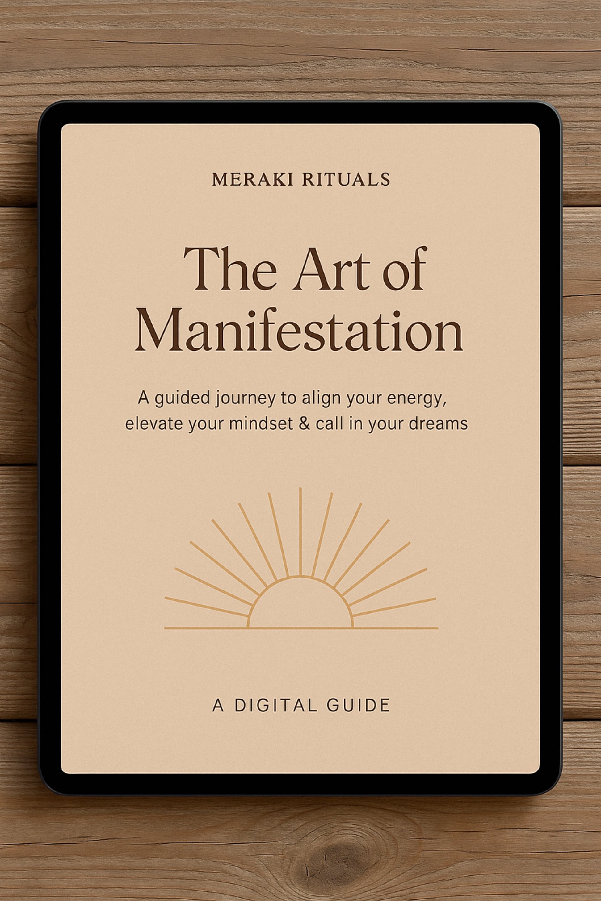 Digital guide titled 'The Art of Manifestation' by Meraki Rituals on a wooden surface