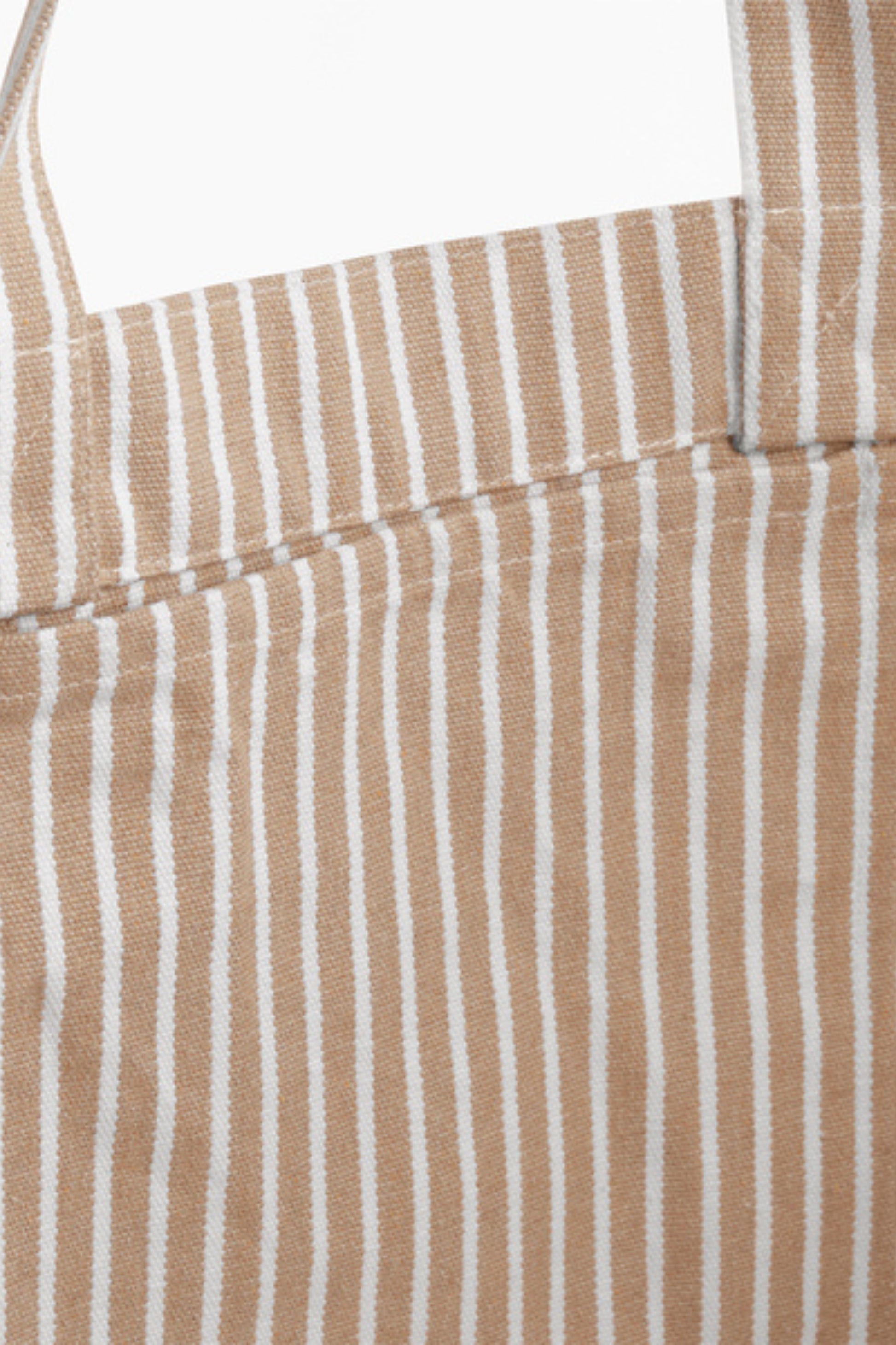 Close up of the NOLA sustainable Oversized Beach Bag , showing internal pocket in striped Biscuit by Meraki Beach