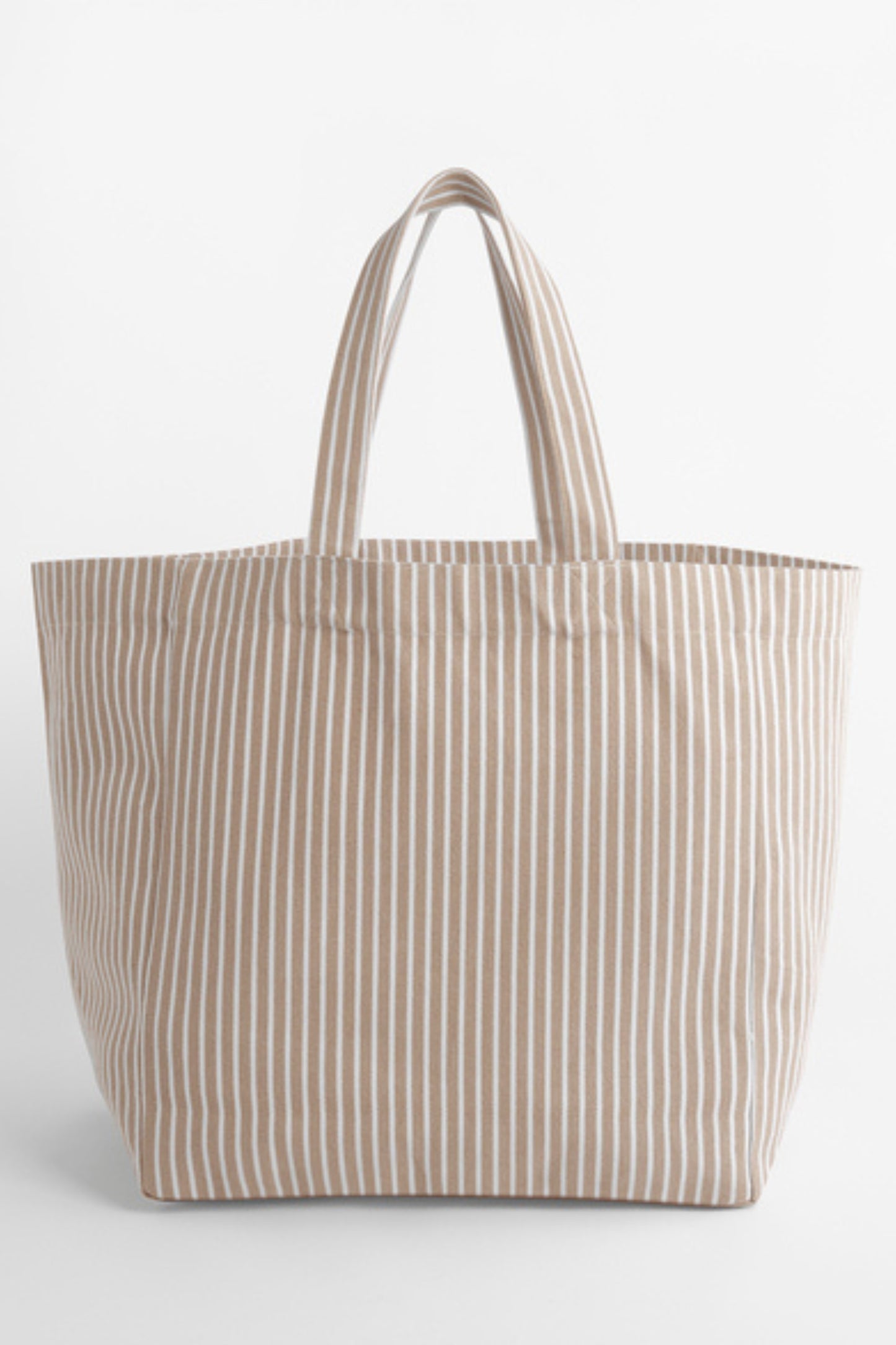 The NOLA sustainable Oversized Beach Bag in striped Biscuit by Meraki Beach