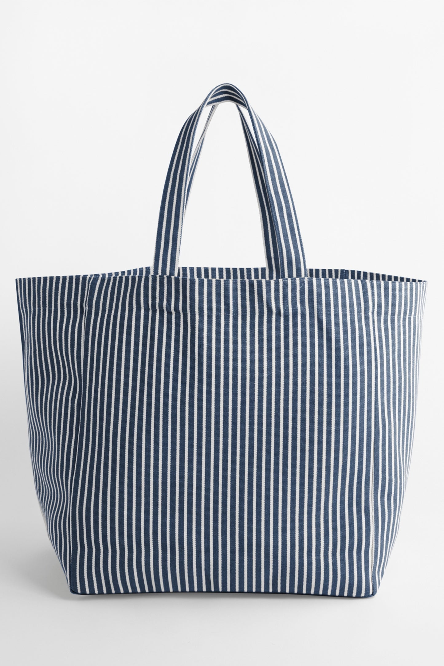 The NOLA sustainable Oversized Beach Bag in striped Navy by Meraki Beach